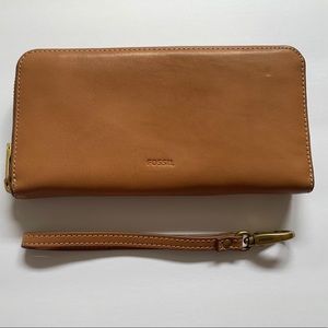 Fossil wallet with detachable wrist strap.